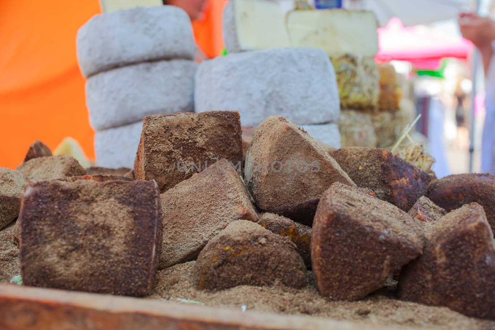 Close up of delicious Italian cheeses covered in a layer of spices