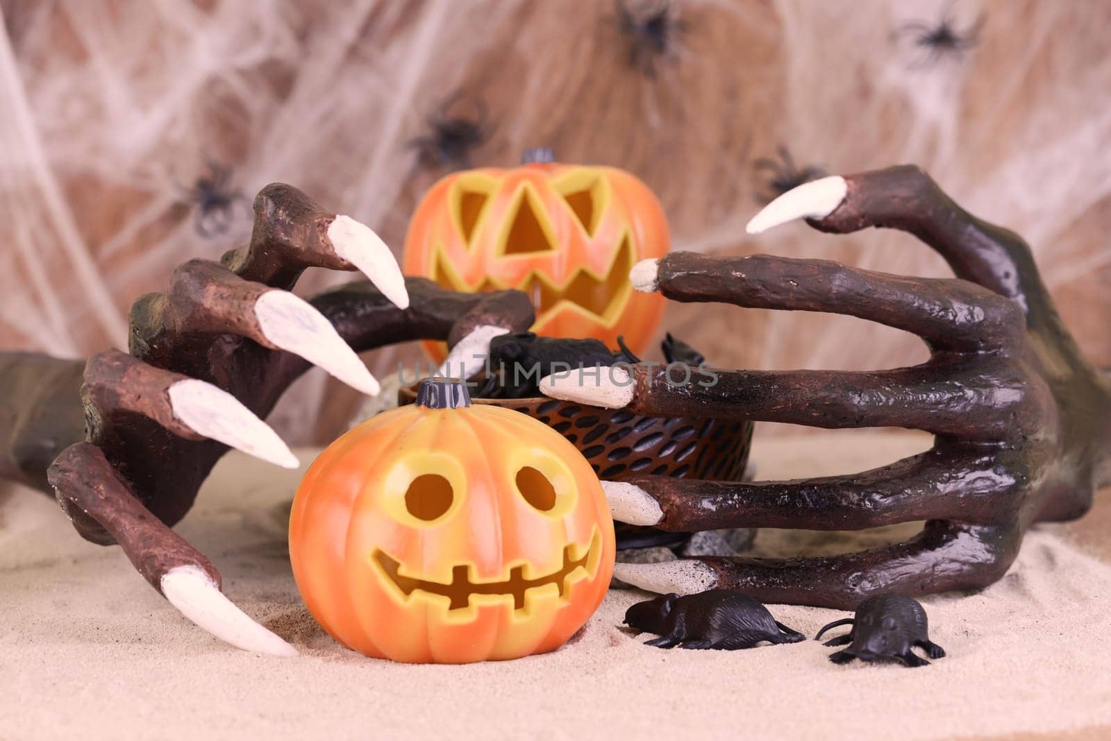 Halloween witch hand and Jack O' lantern pumpkin ornament