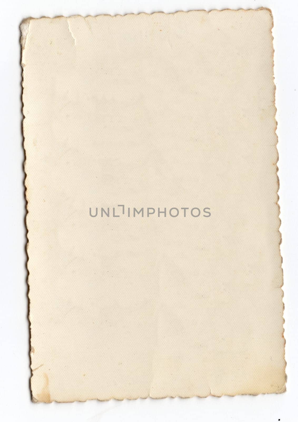 An old piece of paper with worn corners and crease marks.