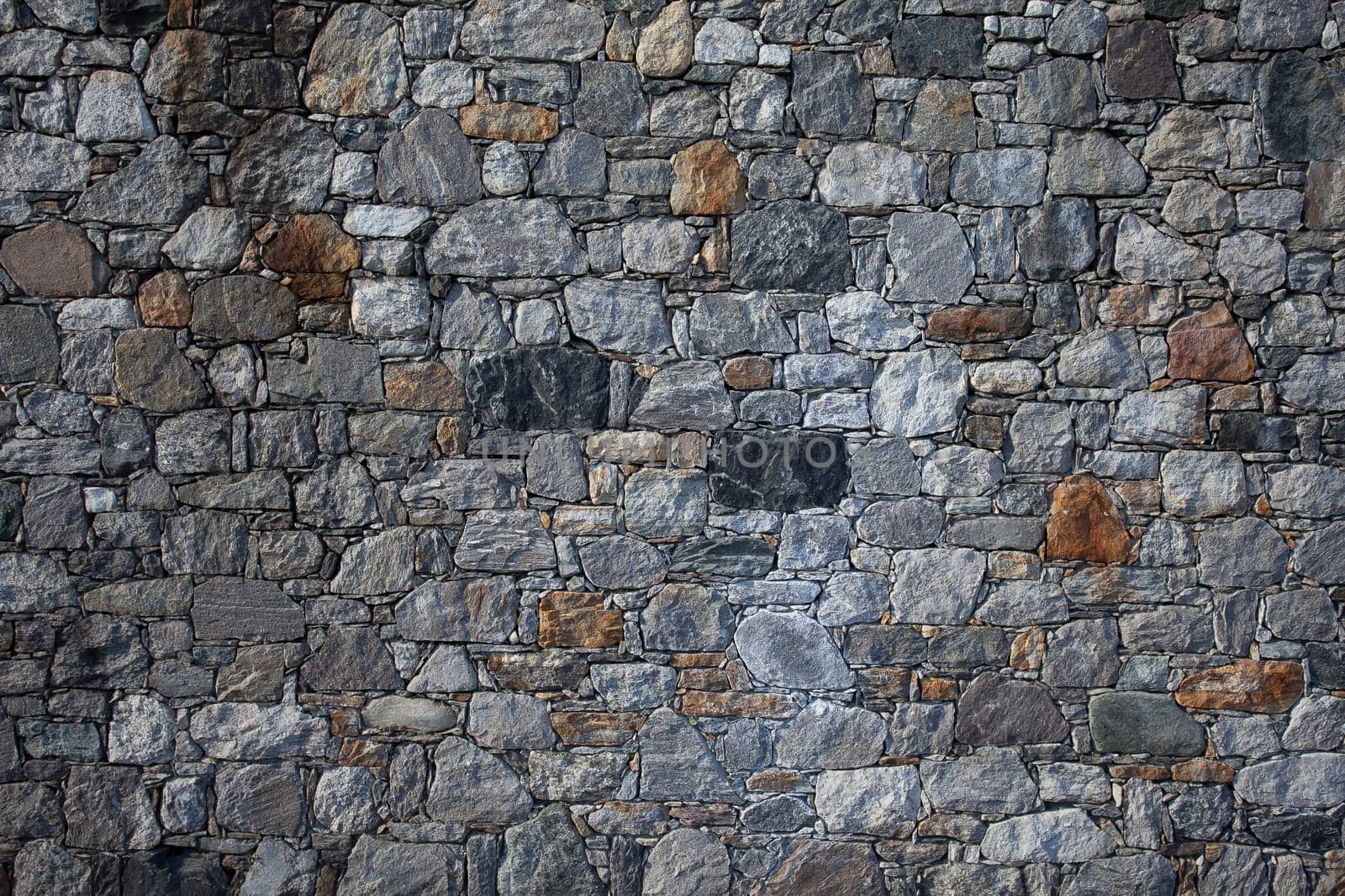 Stone wall, flat stacked background and texture