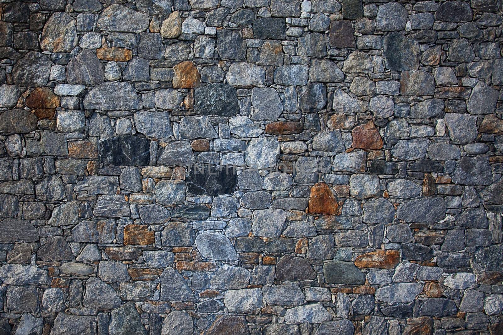 Stone wall, flat stacked background and texture