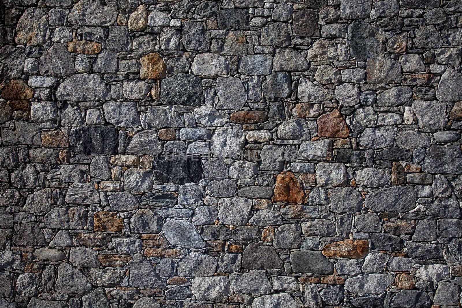 Stone wall, flat stacked background and texture