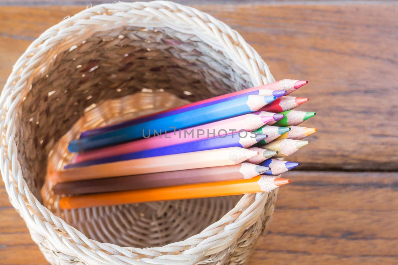 Group of multi colored pencils in craft box, stock photo