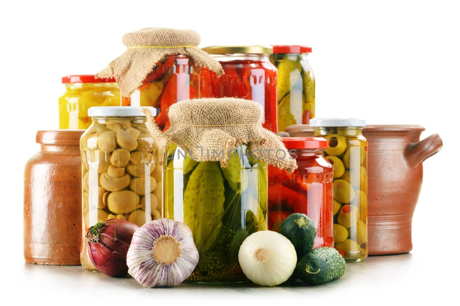Composition with jars of pickled vegetables. Marinated food