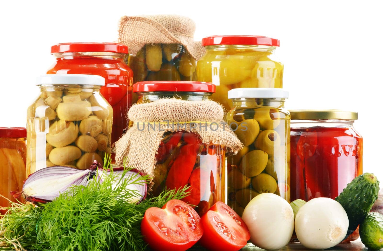 Composition with jars of pickled vegetables. Marinated food