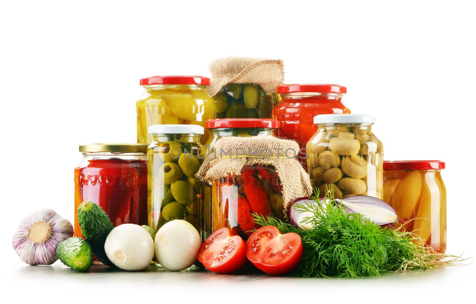 Composition with jars of pickled vegetables. Marinated food