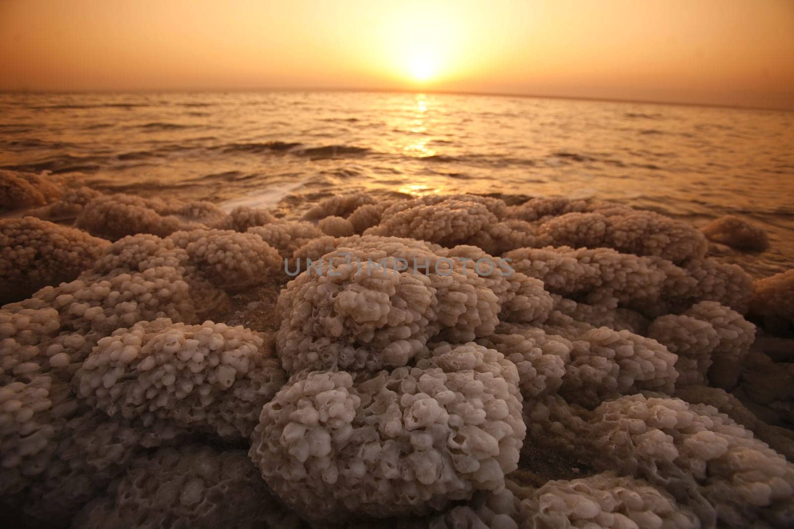The coast with natural salt of the death sea neat the Village of Mazraa in Jordan in the middle east.