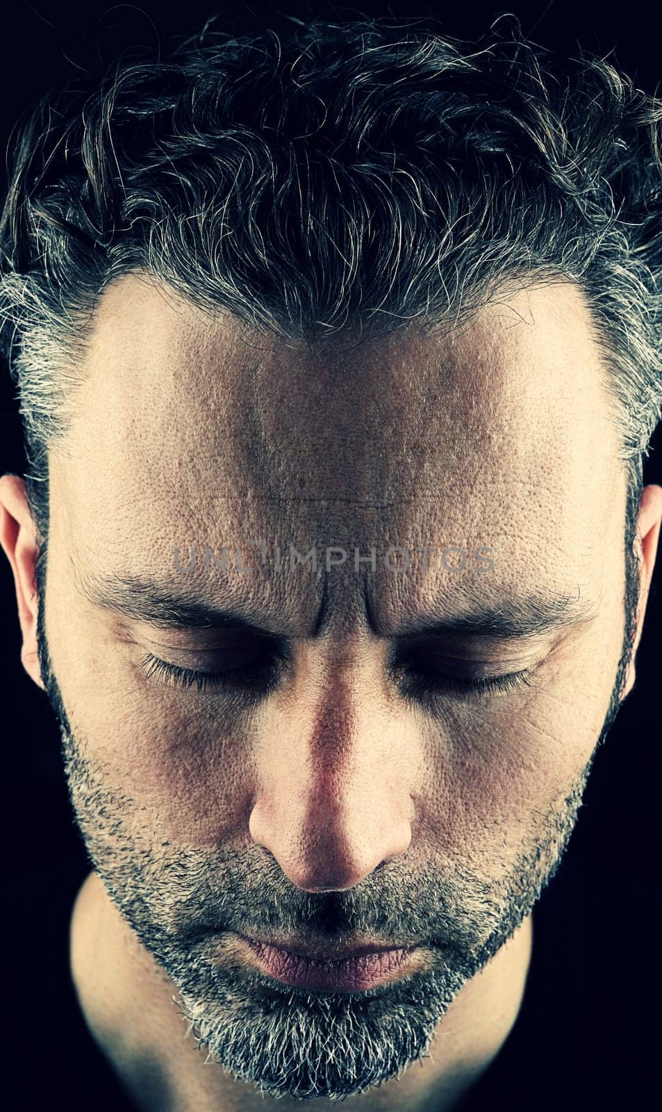 Thinking man with closed eyes