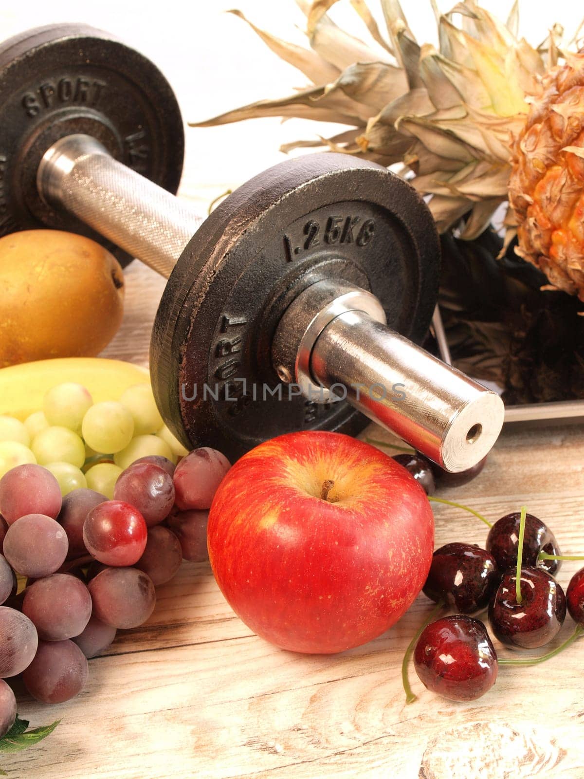 Fresh fruits with sports equipment