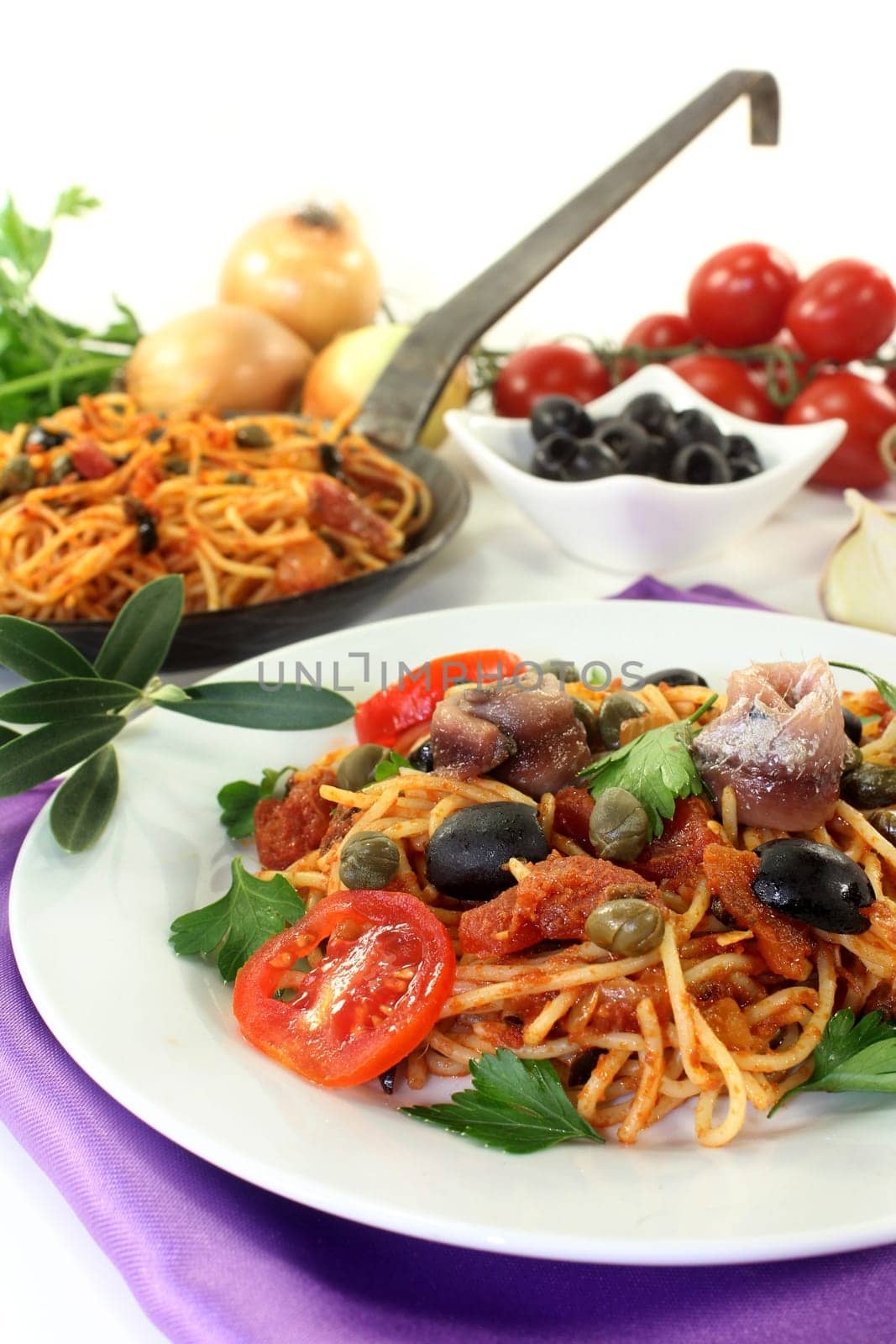 Capellini with tomatoes,anchovies,capers and olives