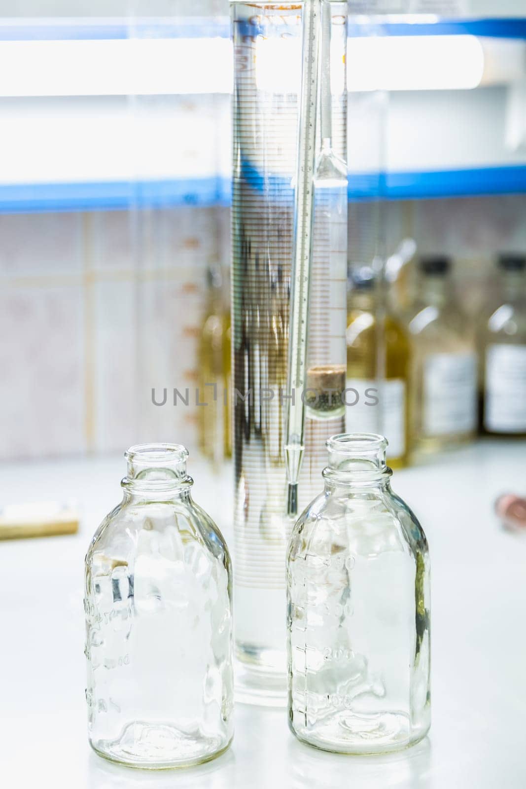 Empty glass bottles on table. Research laboratory glassware