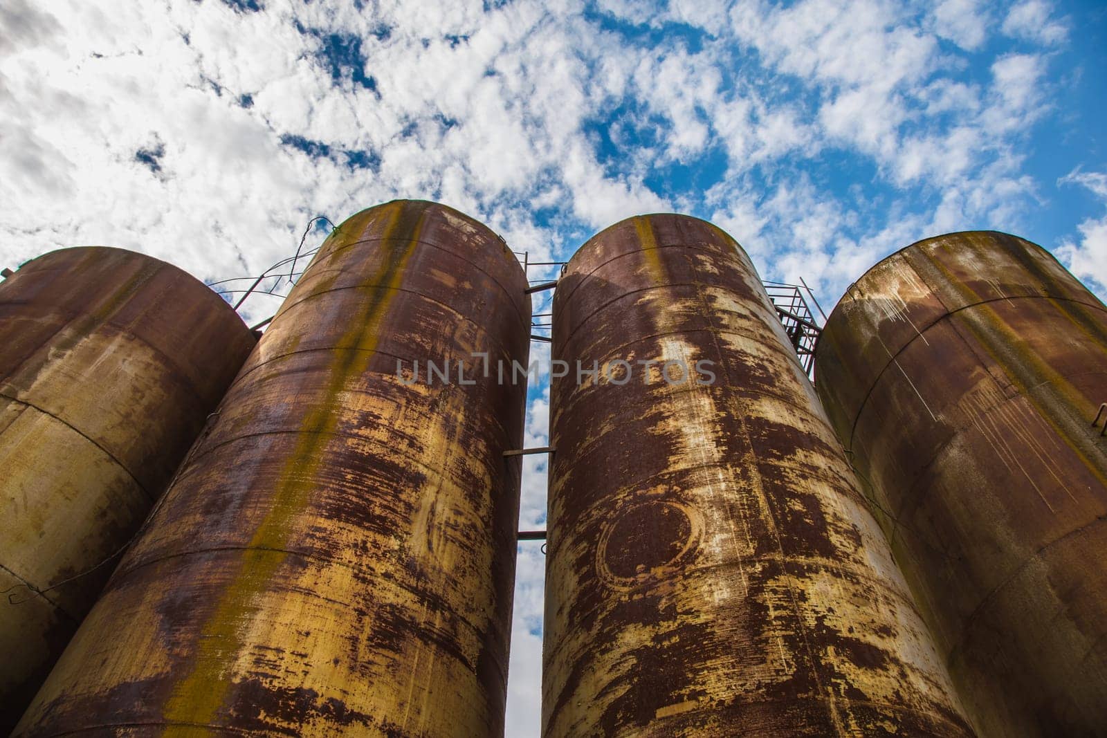 Big old deserted rusty tanks