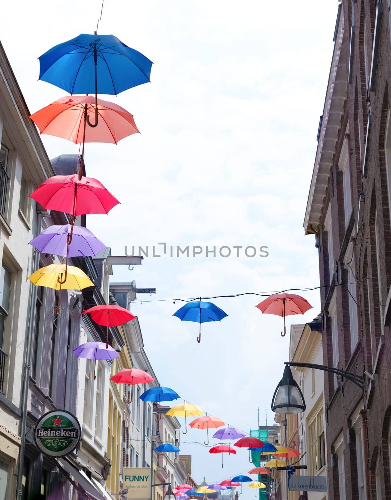 colorful umbrellas in the streets of Deventer, netherlands during "Deventer on stilts"", one of the most prestigious outdoor theatre festivals in the country"