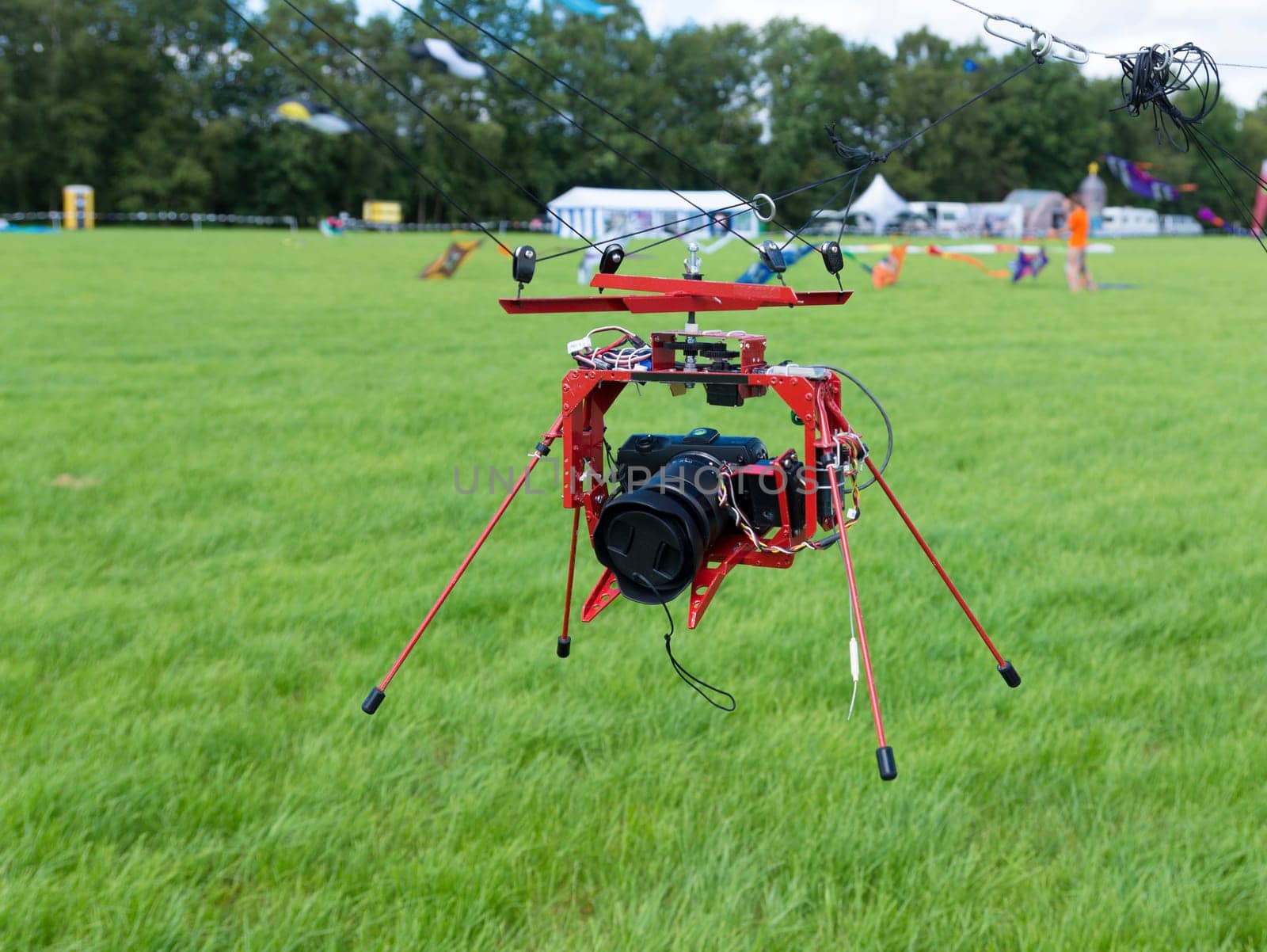camera hanging under a kite for taking aerial pictures