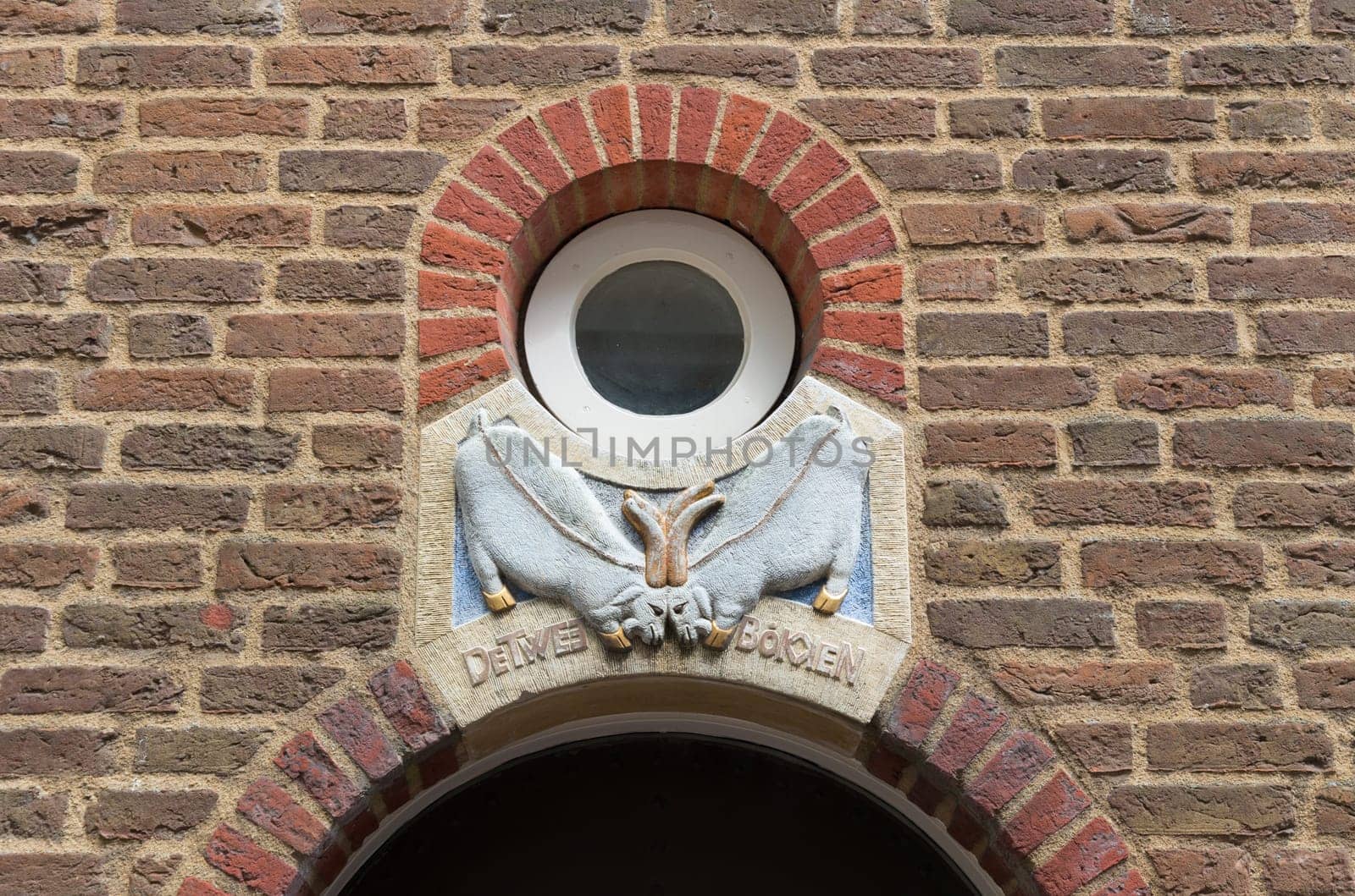 ancient facade ornamentation of two goats in deventer, netherlands