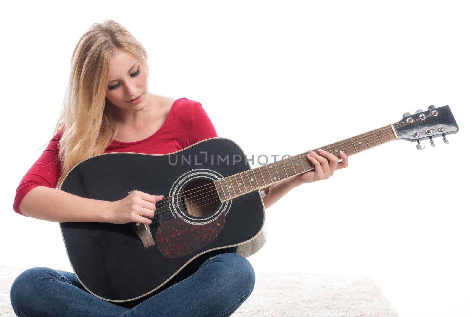 young blonde woman with guitar