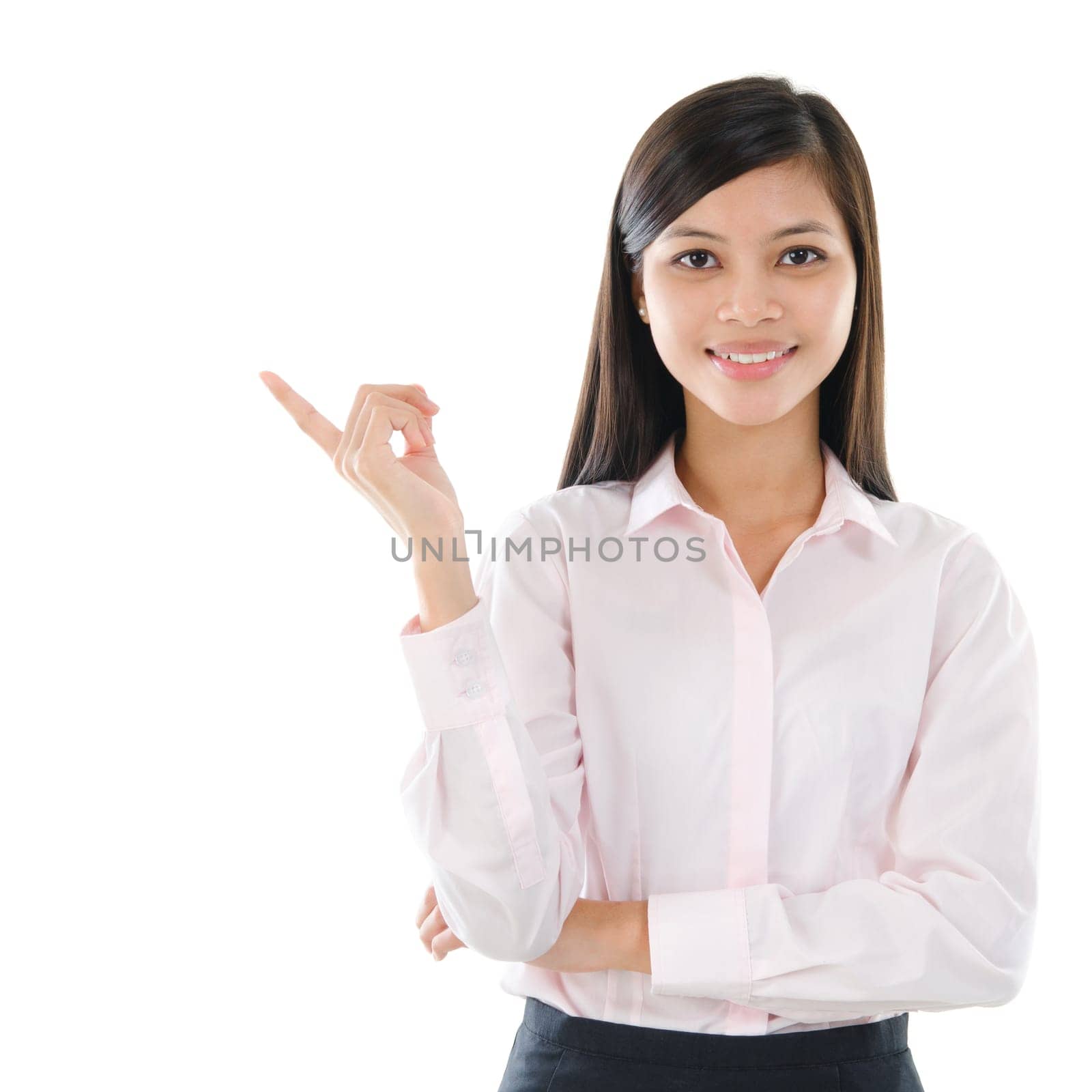 Young mixed race pan Asian business woman pointing on copy space isolated  on white background
