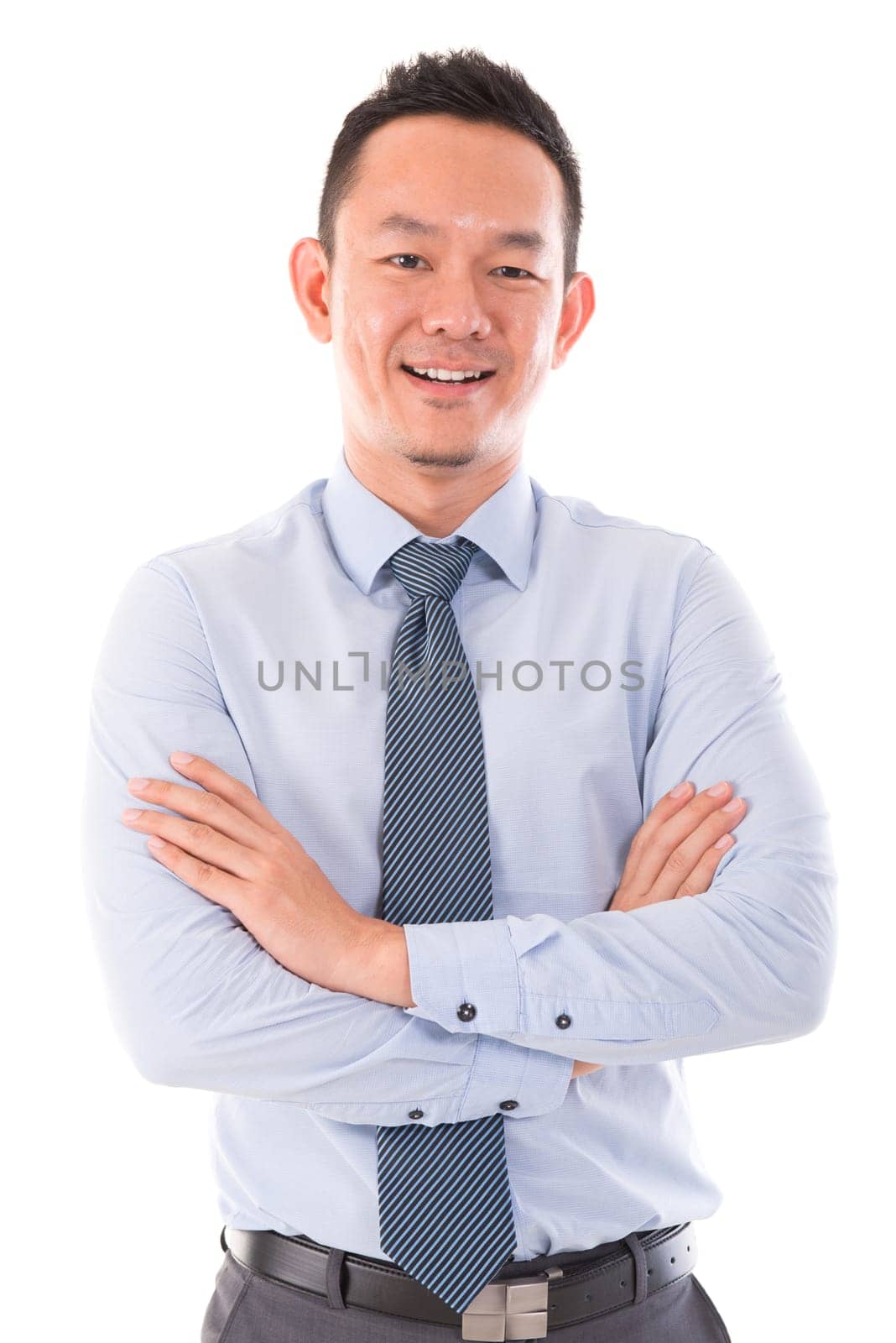 Asian business man smiling, standing isolated over white background.