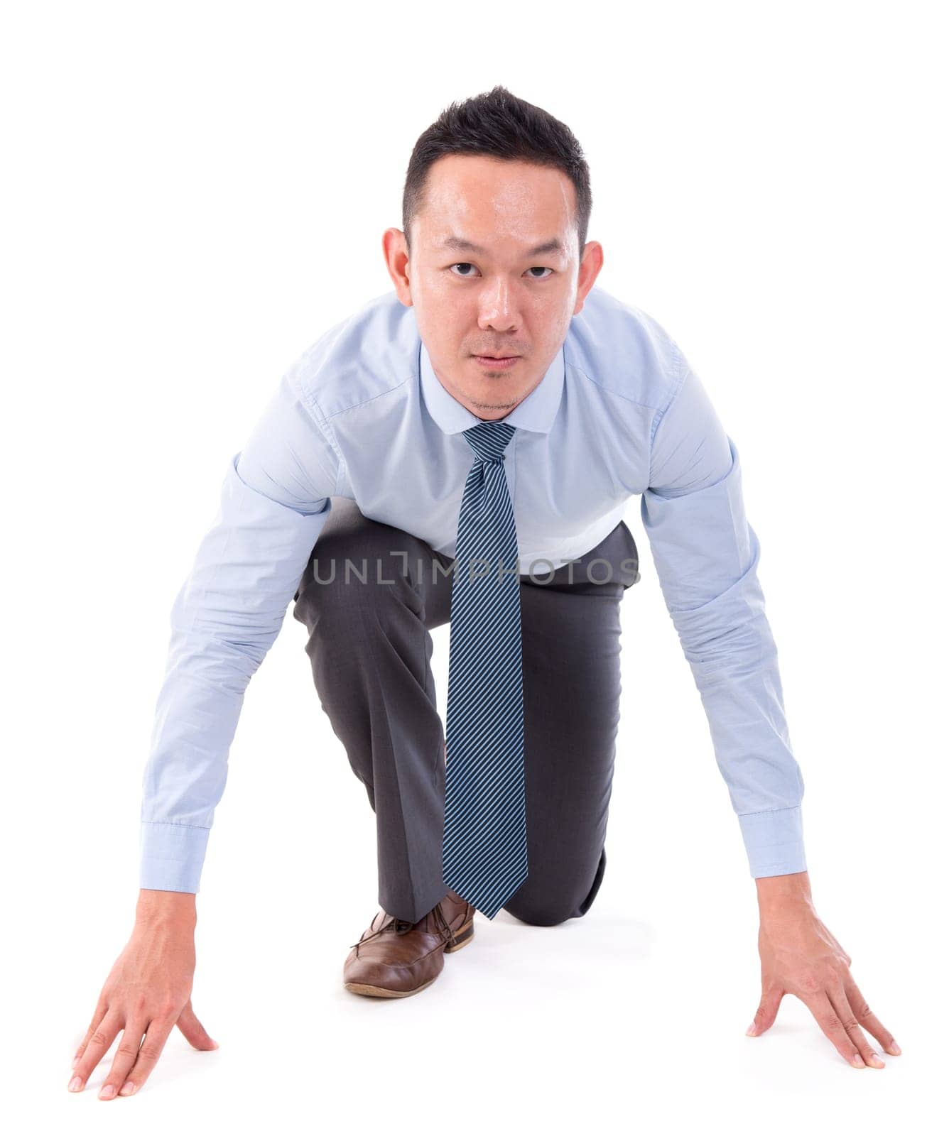 Asian business male on starting line of a race, front view full length isolated over white background.