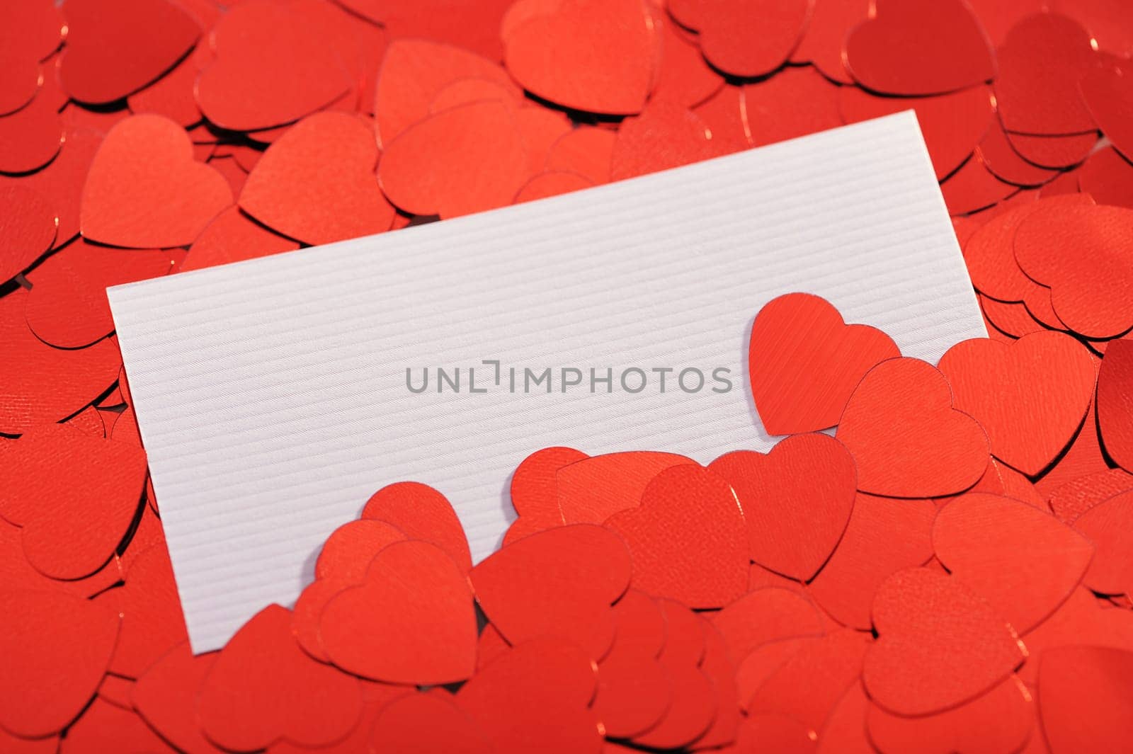 Red glitter hearts with white congratulations card