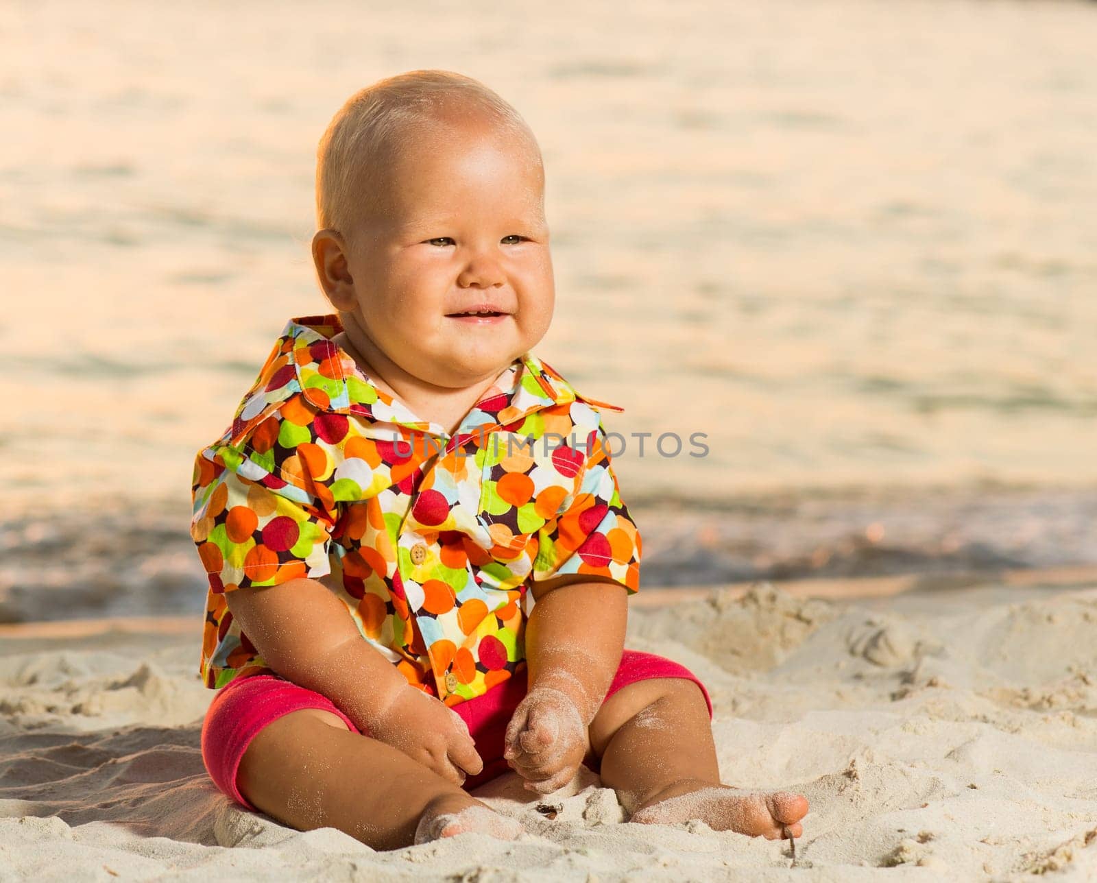 Cute baby on the tropical beach