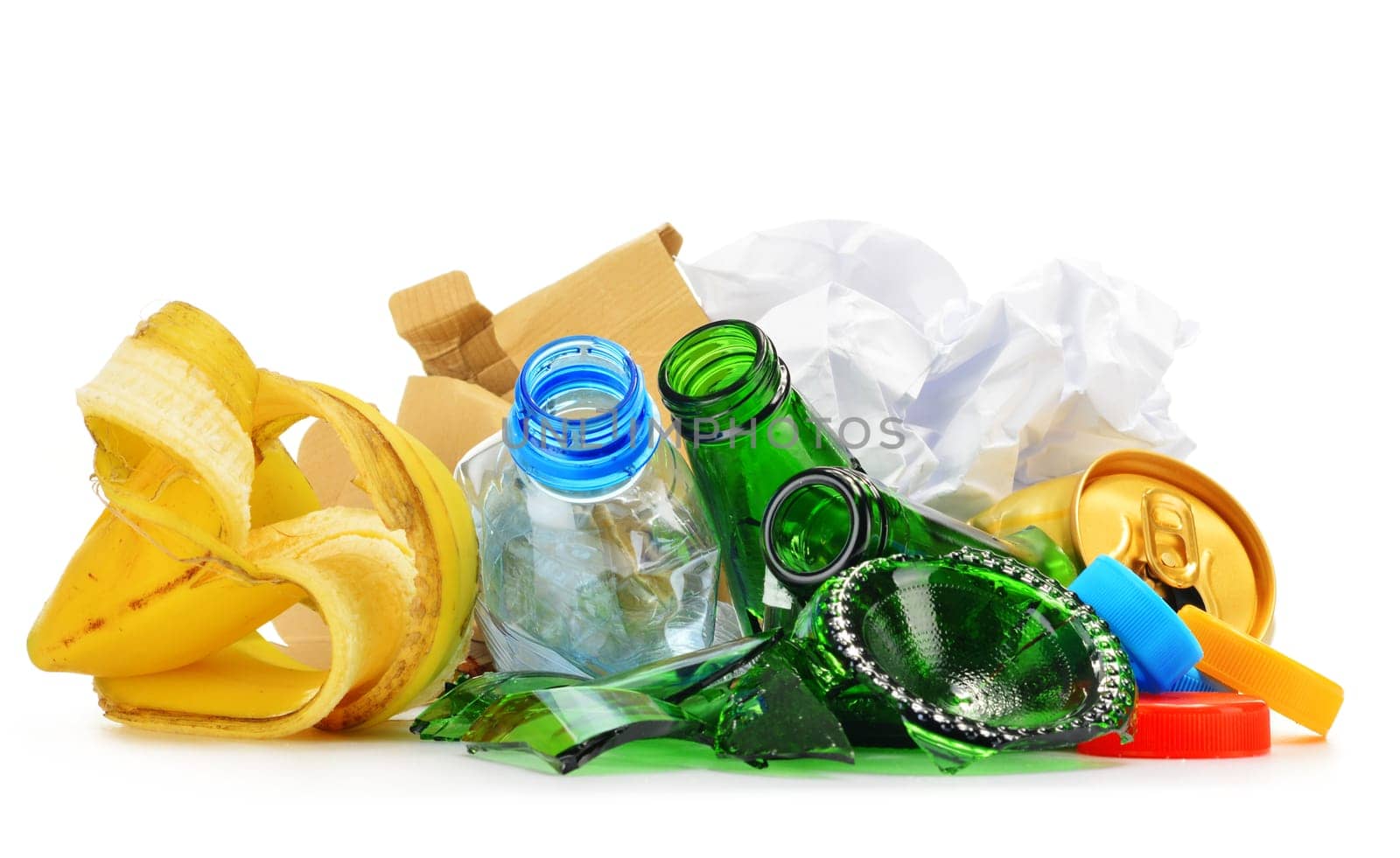 Composition with recyclable garbage consisting of glass, plastic, metal and paper isolated on white background