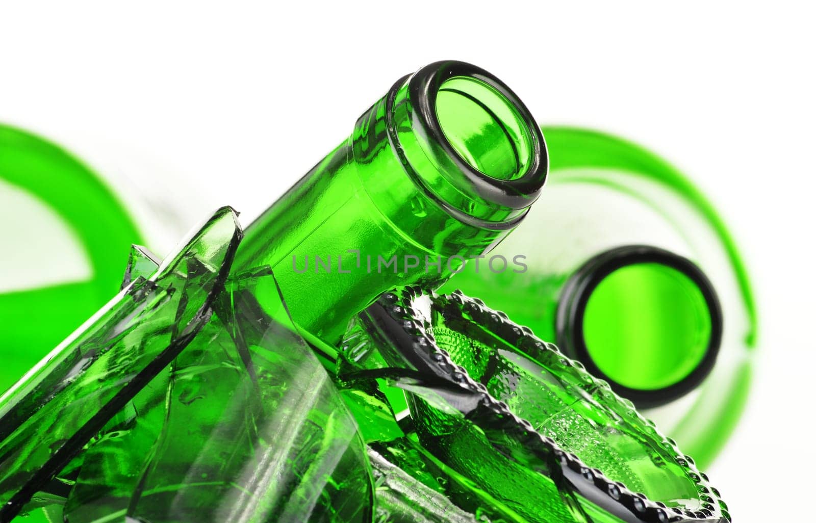 Pieces of broken glass over white background. Recycling.