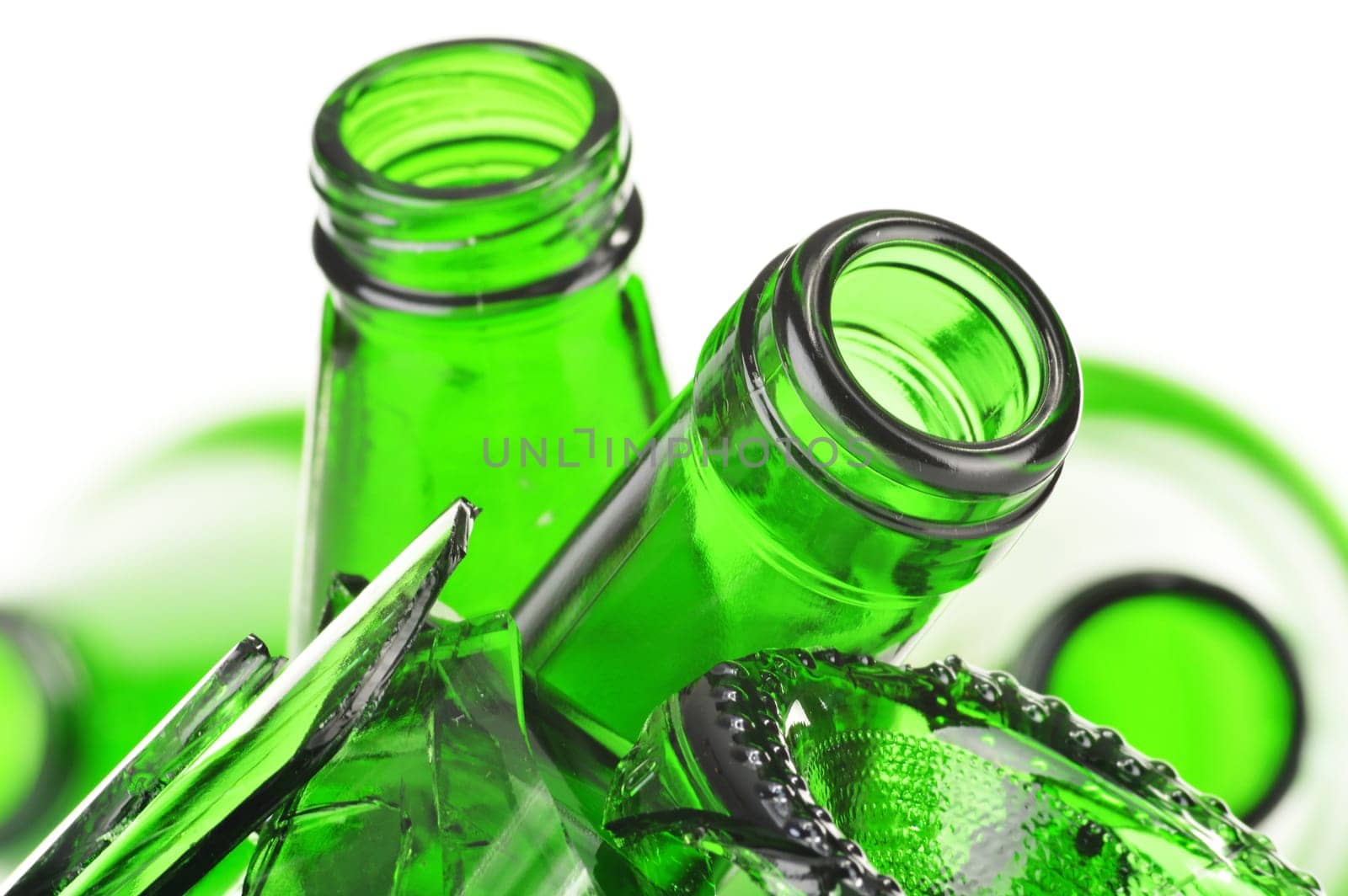 Pieces of broken glass over white background. Recycling.