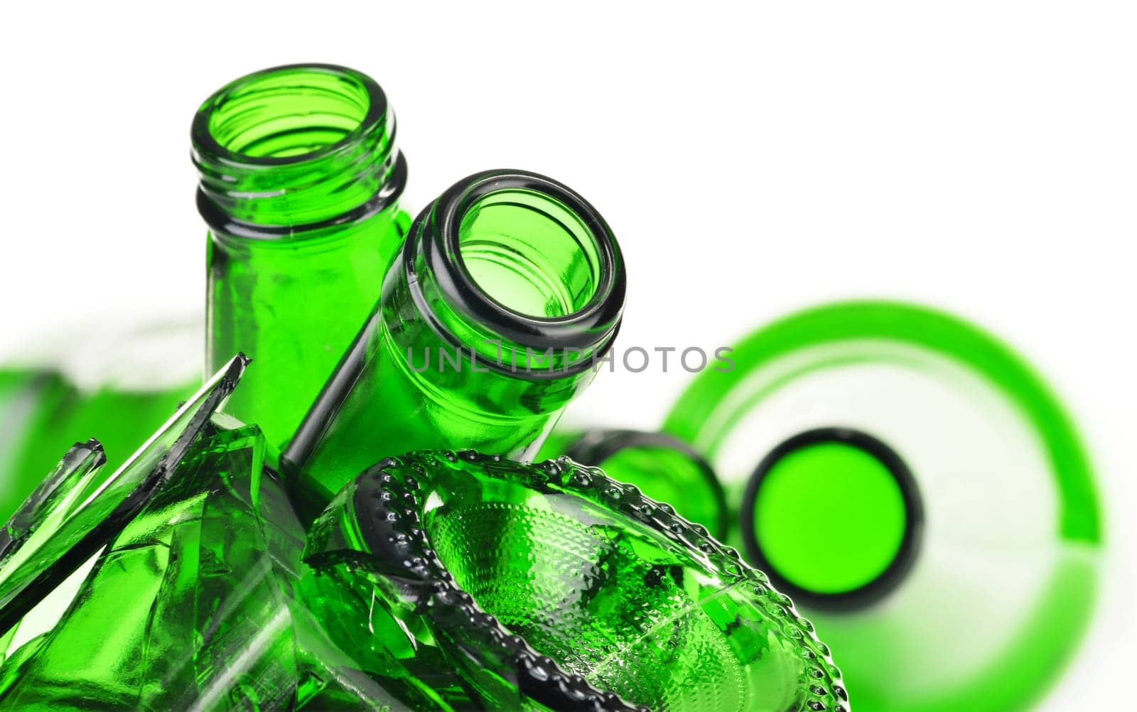 Pieces of broken glass over white background. Recycling.