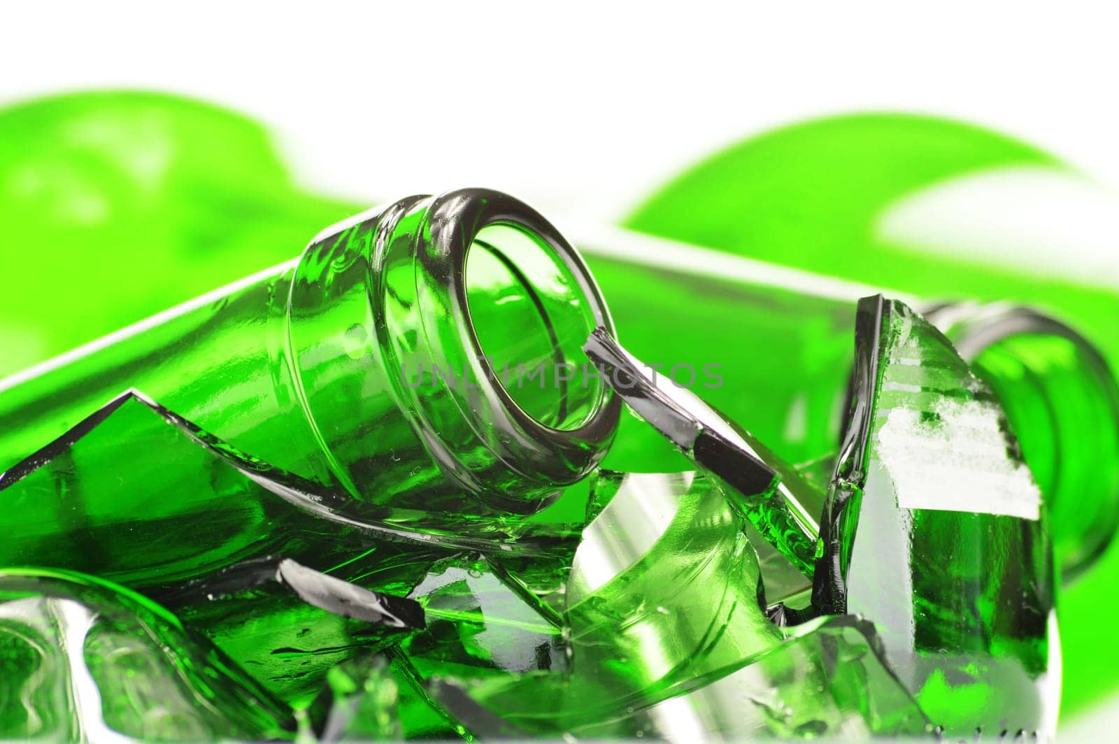 Pieces of broken glass over white background. Recycling.