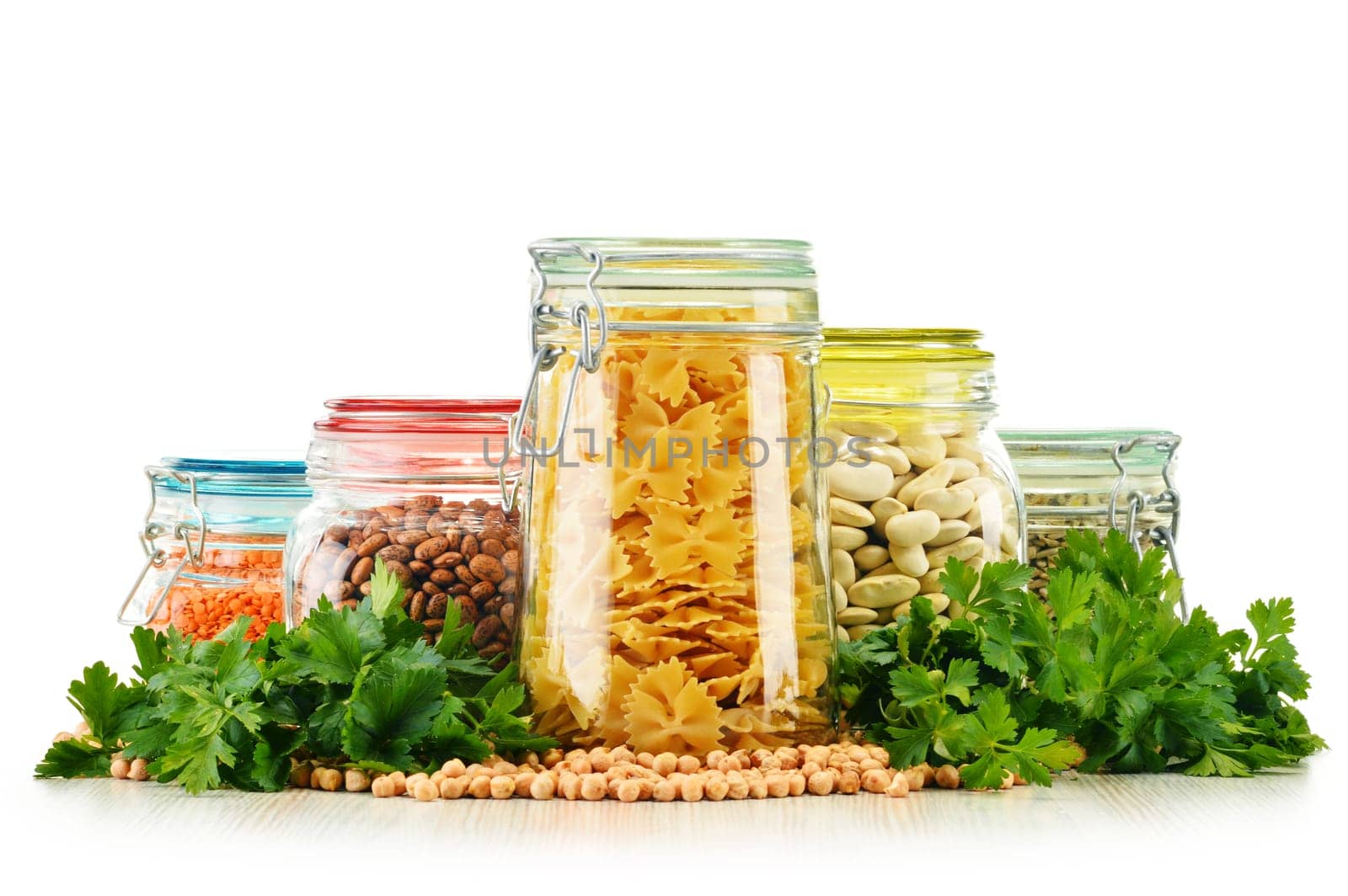 Jars with grain foods isolated on white background