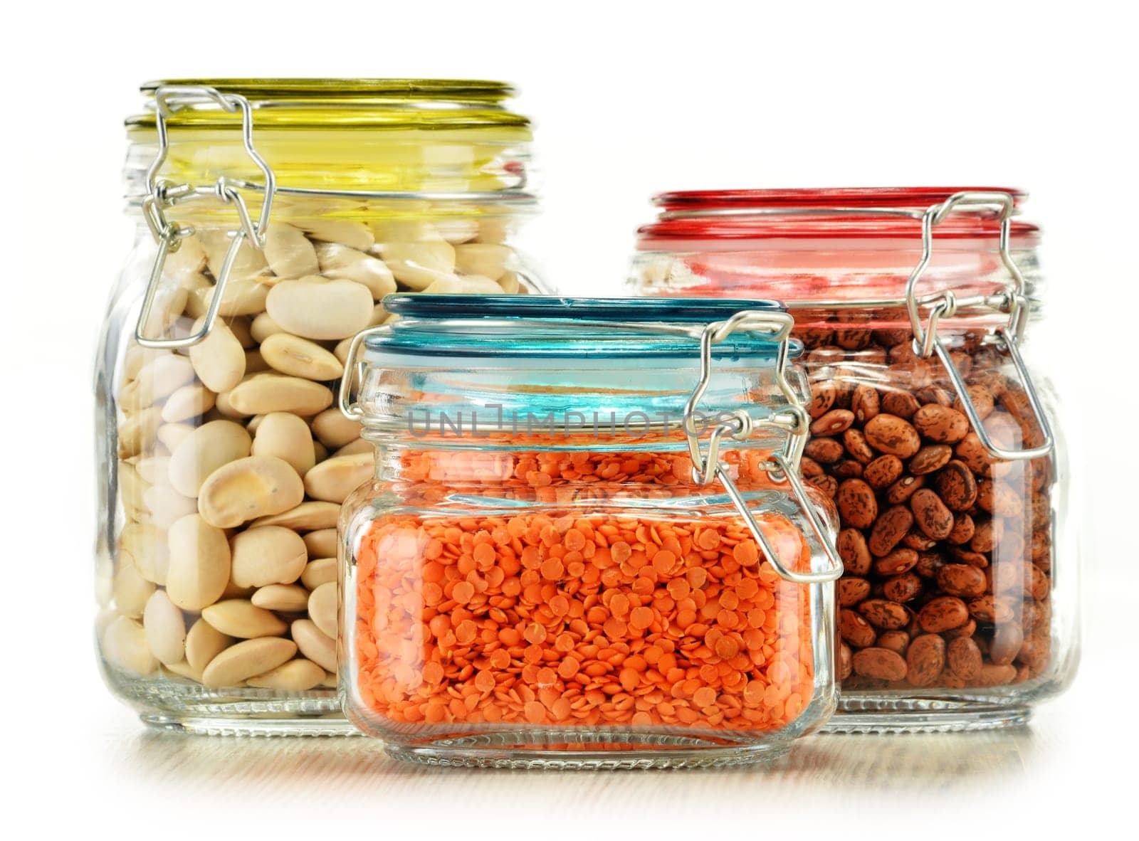 Jars with grain foods isolated on white background