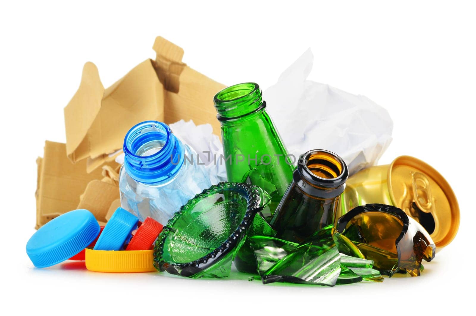 Composition with recyclable garbage consisting of glass, plastic, metal and paper isolated on white background
