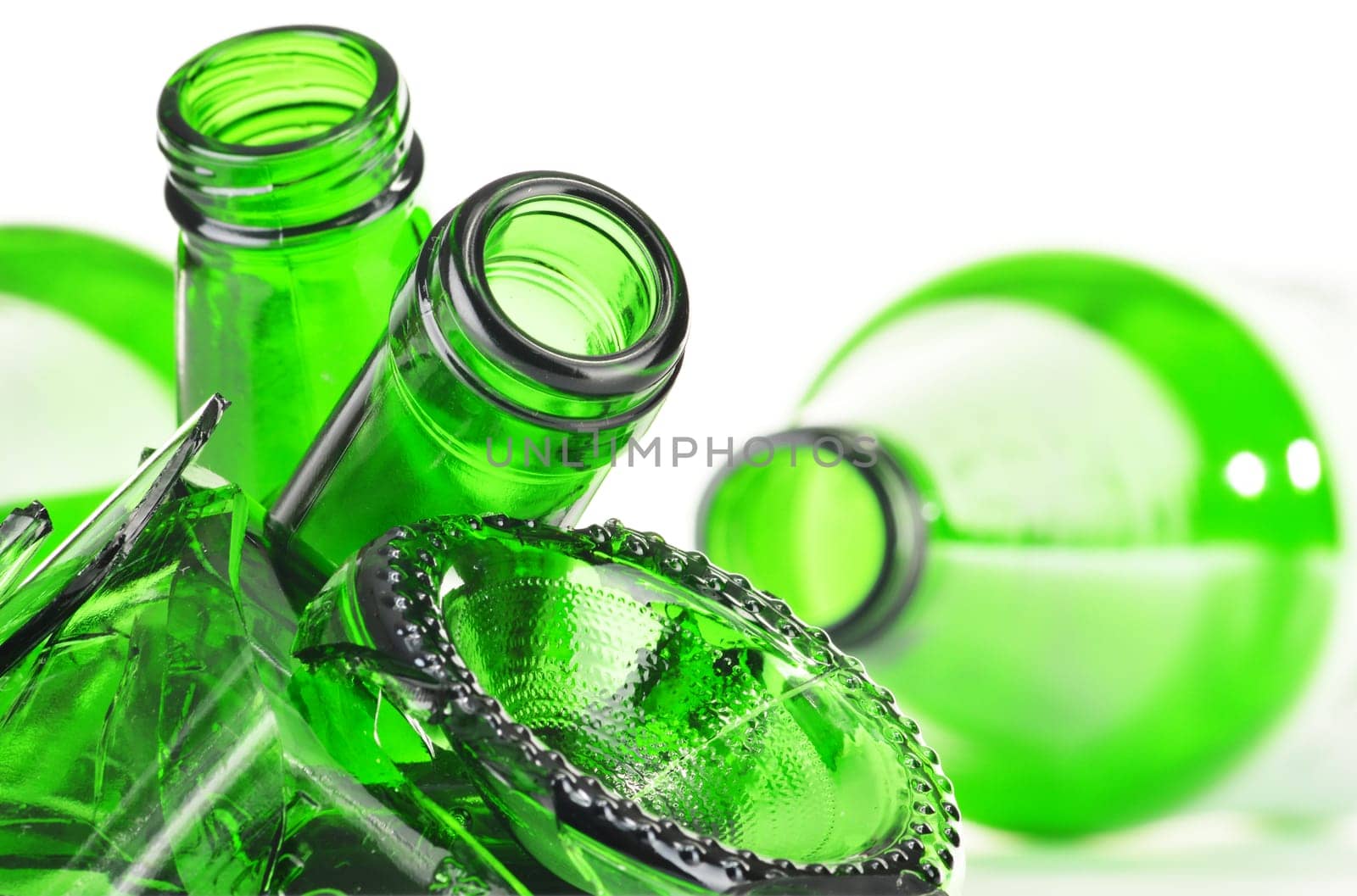 Pieces of broken glass over white background. Recycling.