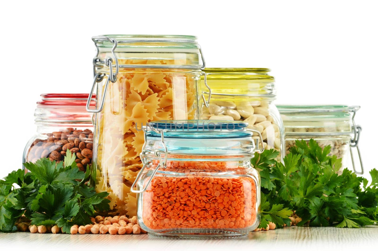 Jars with grain foods isolated on white background