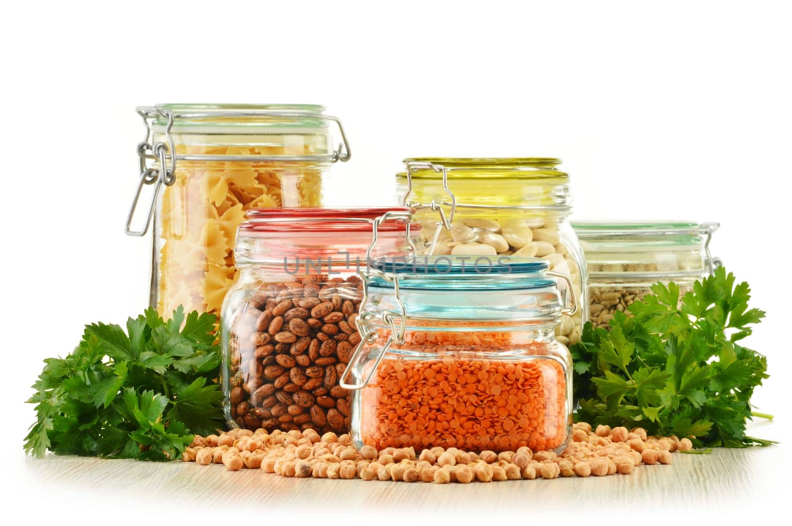 Jars with grain foods isolated on white background