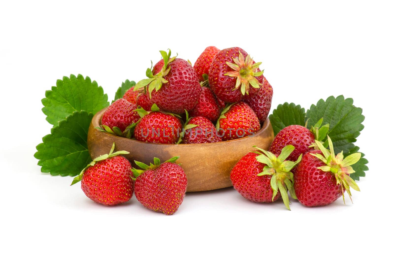 fresh strawberries in a bowl on white background