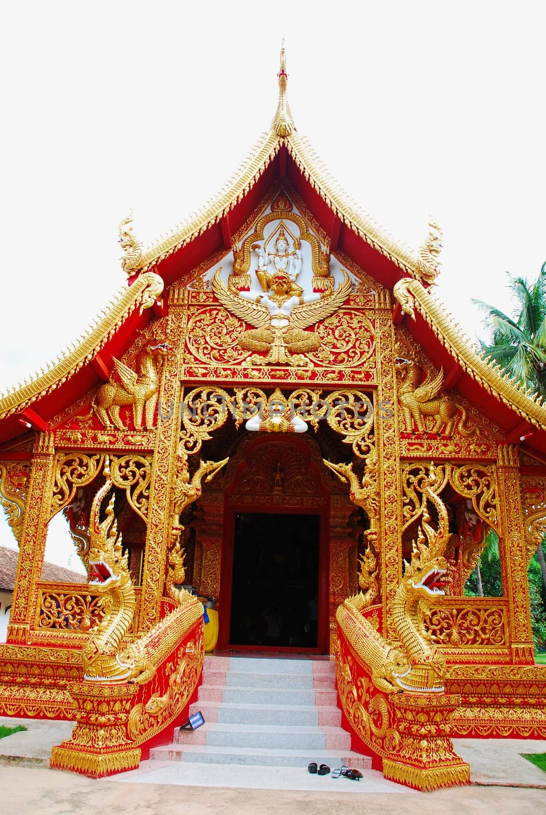 horse carriage and  temple Phrathat Lampang Luang in Lampang, Thailand