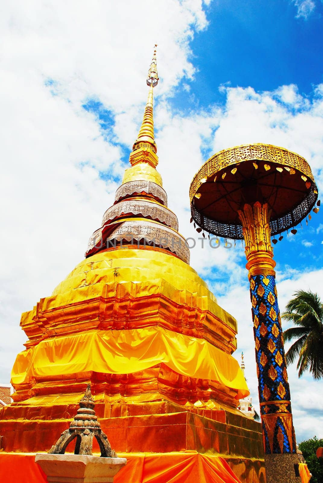 horse carriage and  temple Phrathat Lampang Luang in Lampang, Thailand