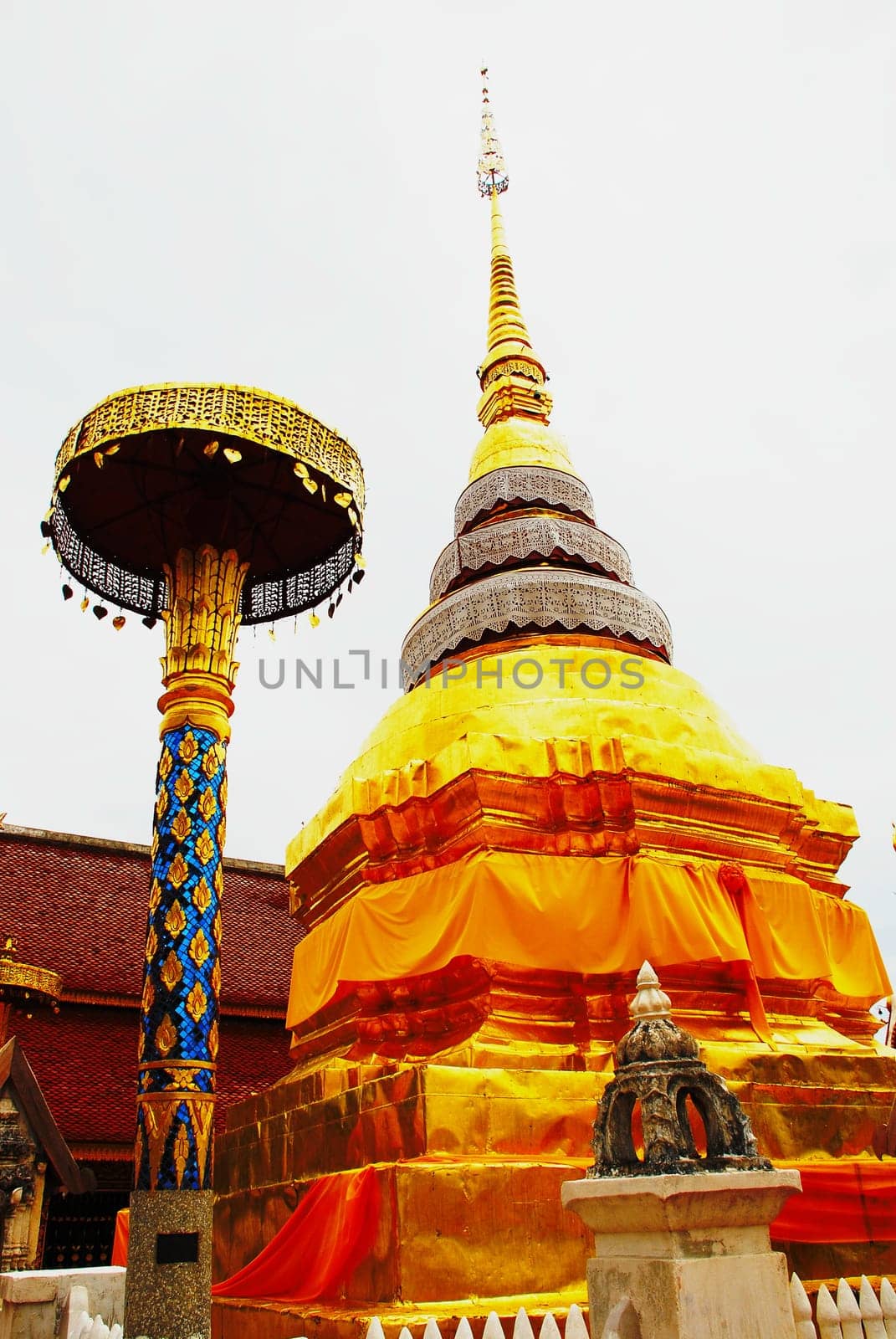 horse carriage and  temple Phrathat Lampang Luang in Lampang, Thailand