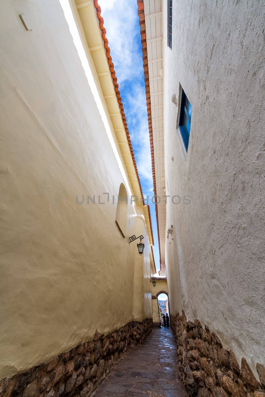Narrow alley in the colonial historic center of Cusco, Peru
