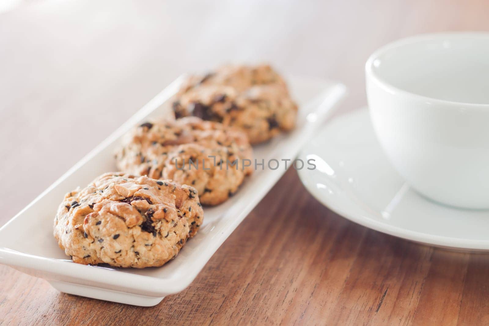 Mixed nut cookies with coffee cup, stock photo