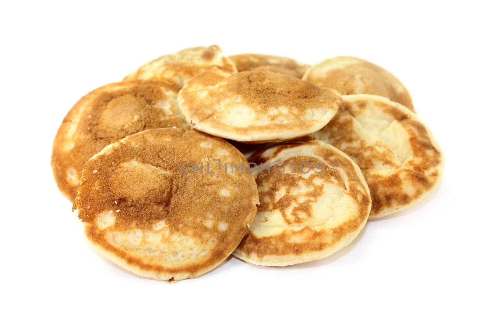 baked Poffertjes against a white background