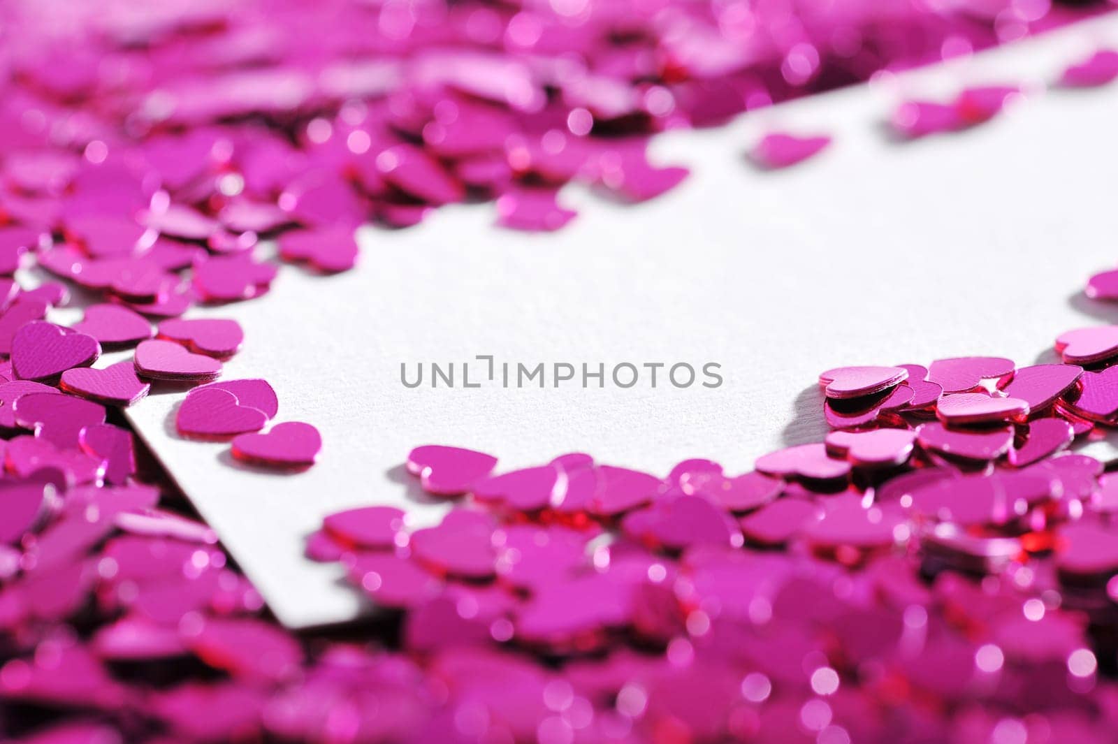 many little pink glitter hearts with white congratulations card