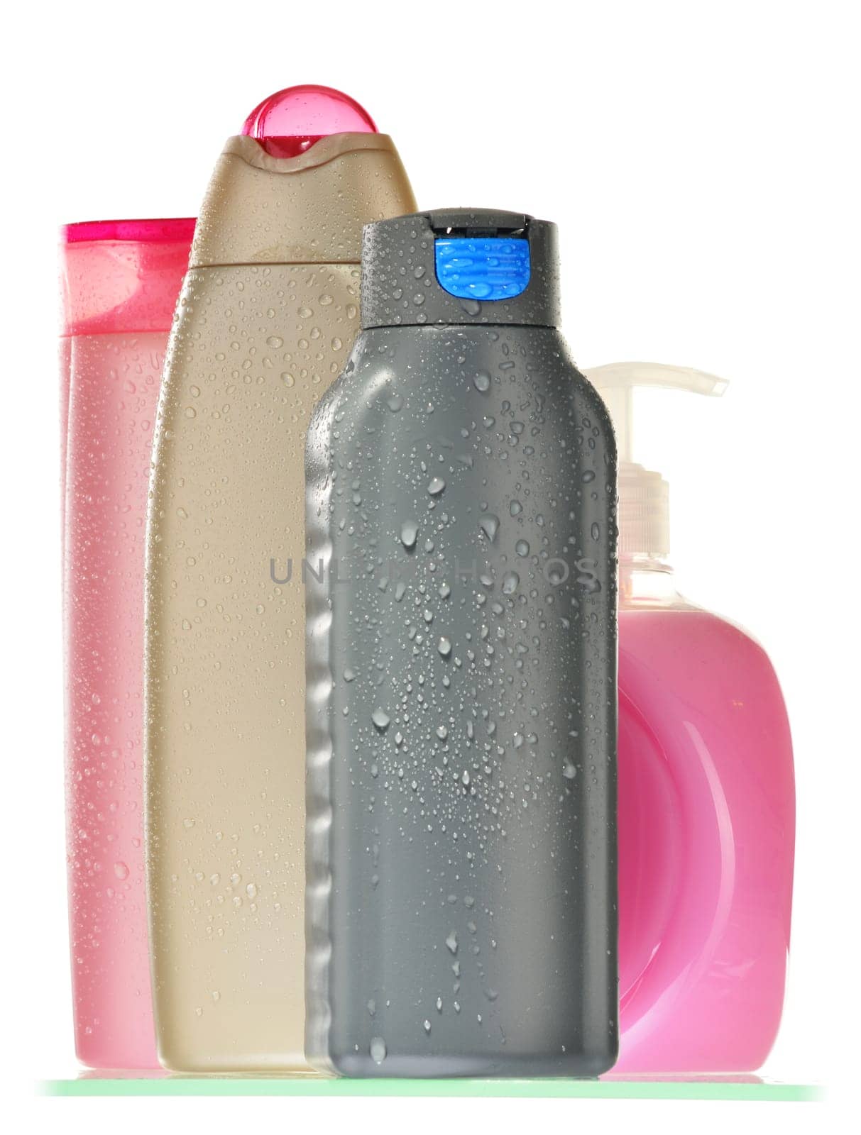 Composition with plastic bottles of body care and beauty products.