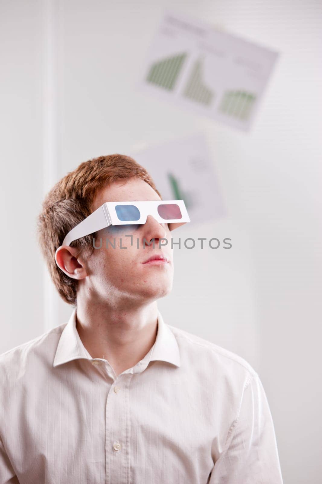 redheaded man with 3d glasses watching into the future