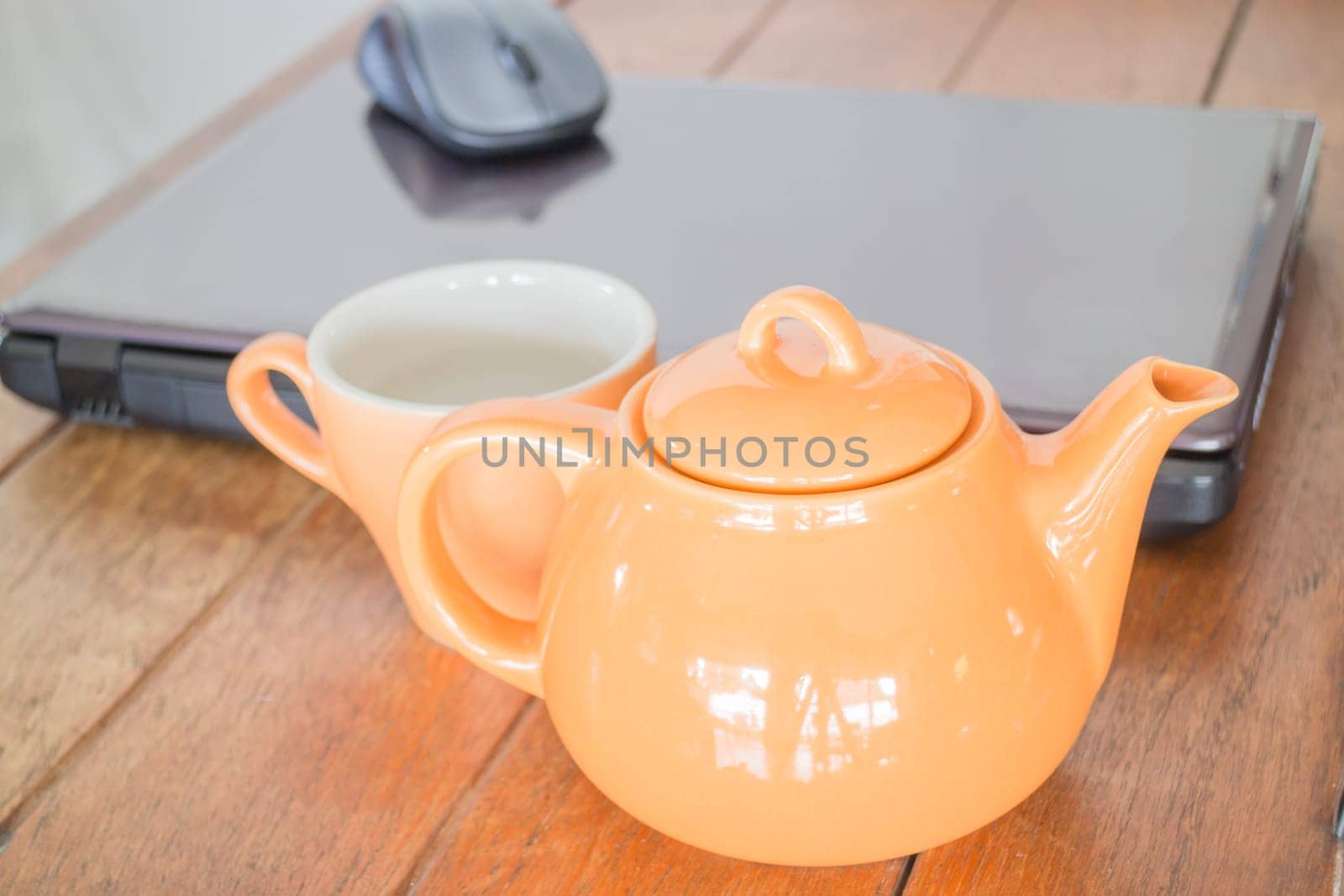 Tea time break in workplace, stock photo