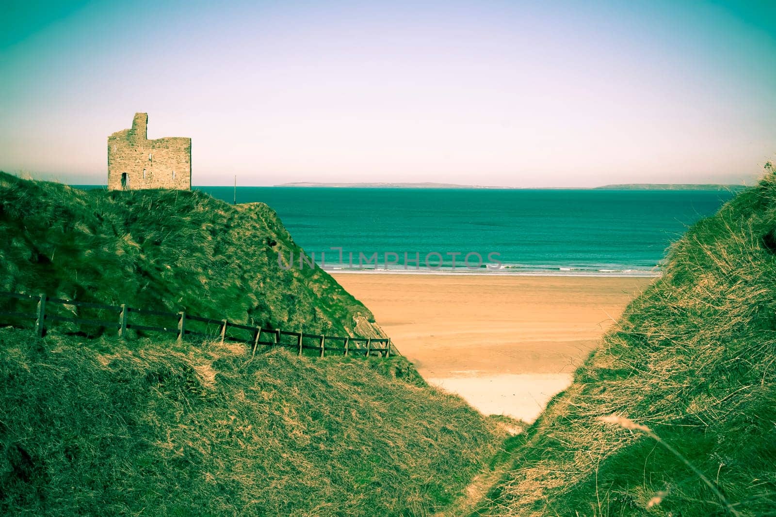 a beautiful fenced path to Ballybunion beach and castle in duotone