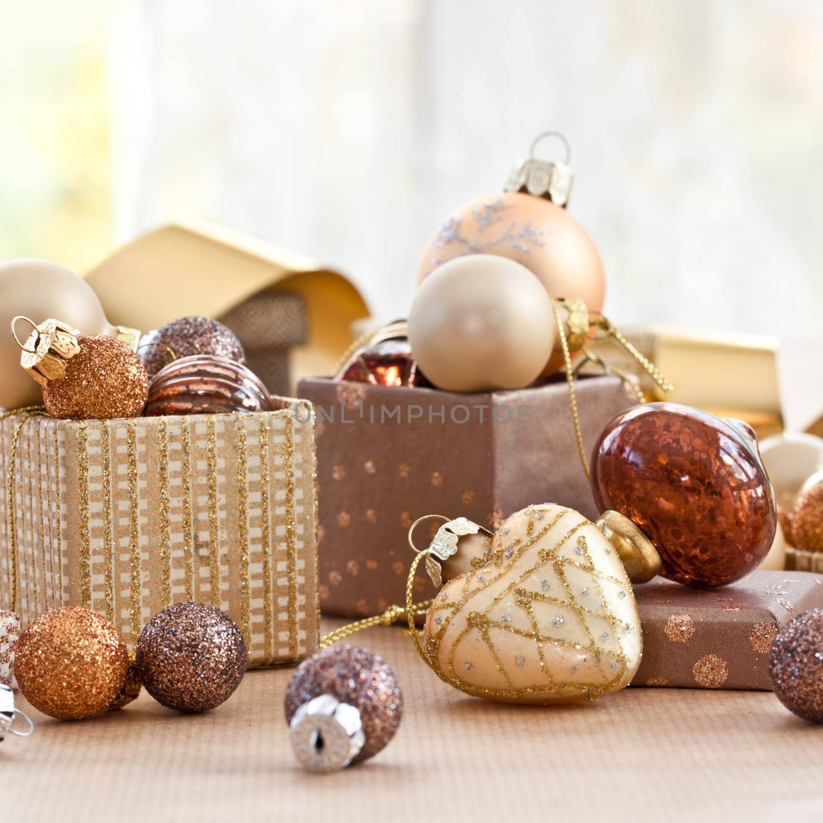Colorful Christmas tree balls in small gift boxes with pattern