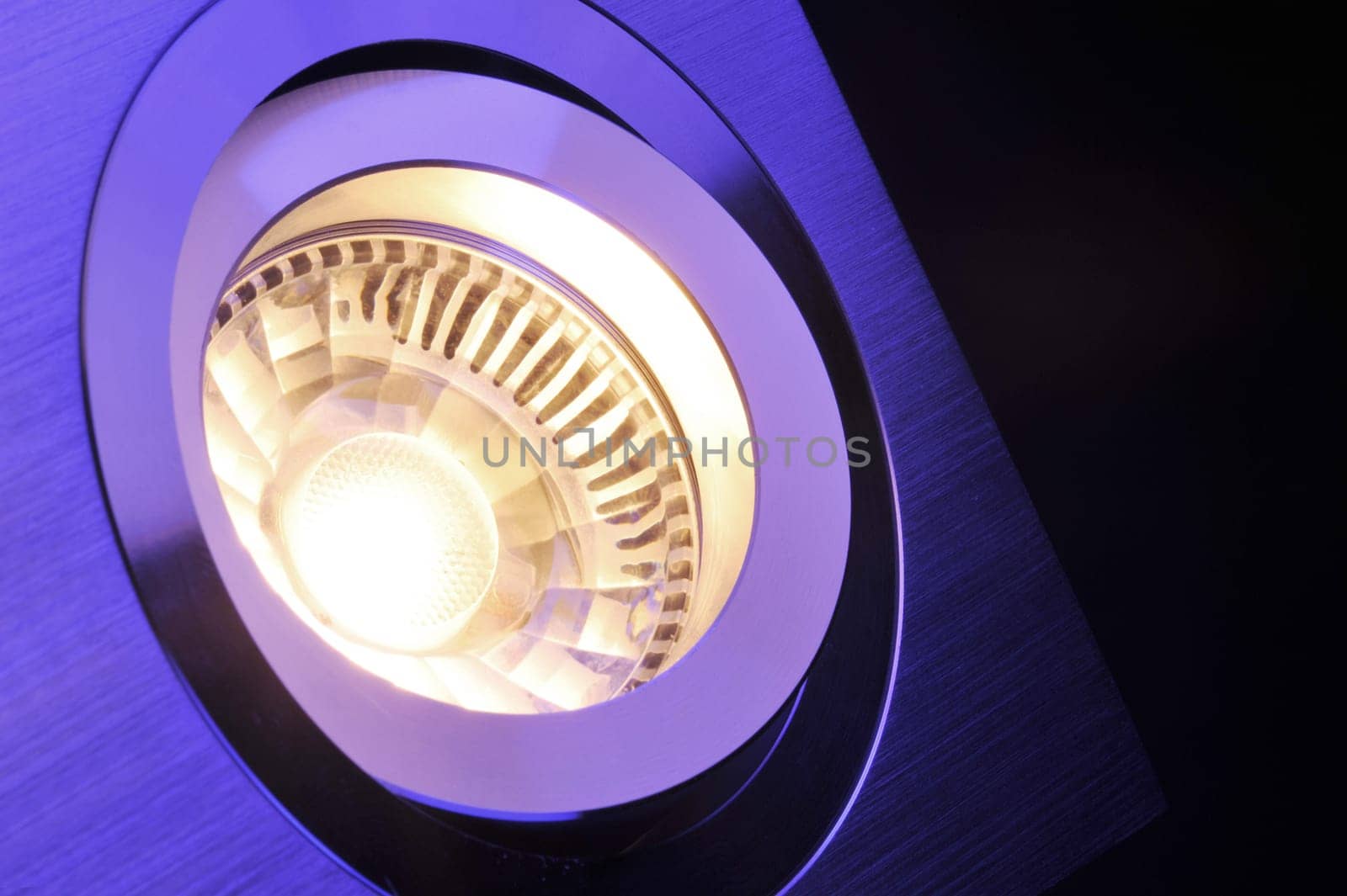 Macrodetail of a warm white COB LED in violet light